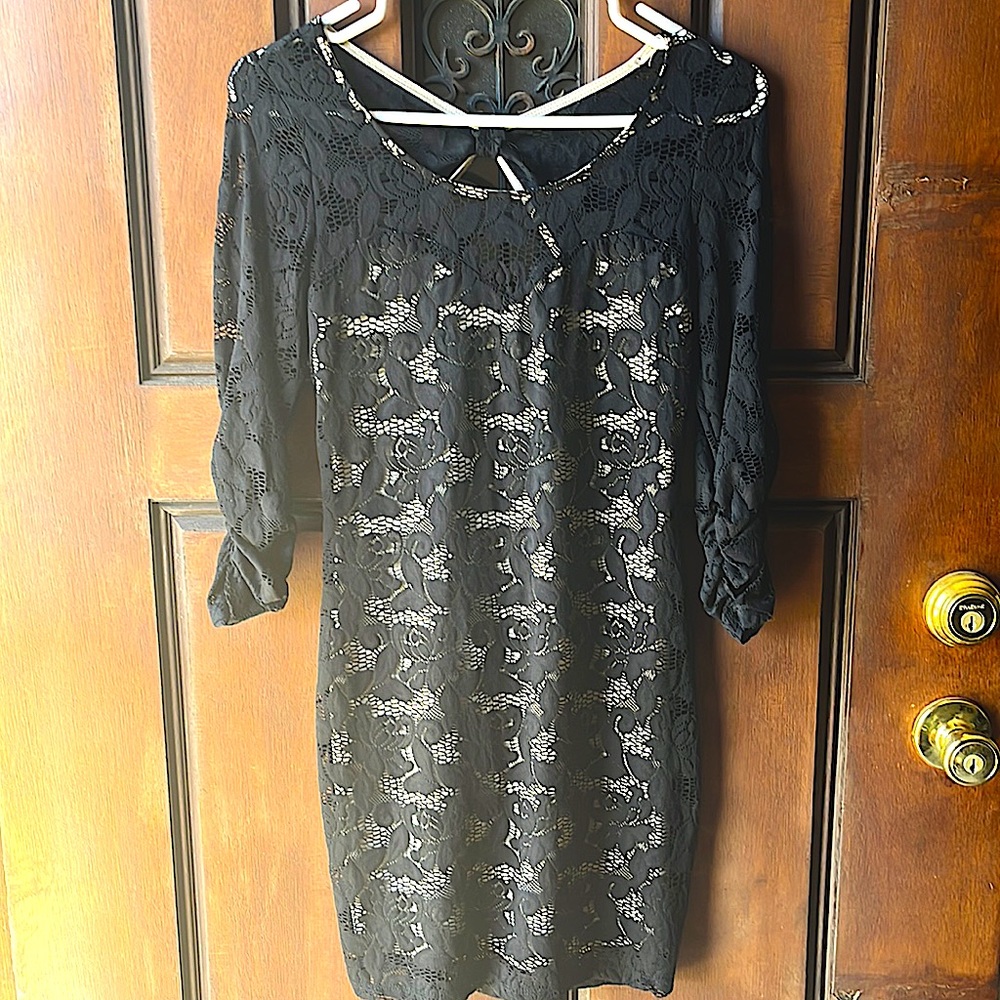 NWT. Black lace dress with low cut back